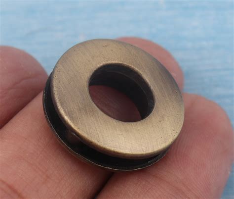 metal grommets for wood holes